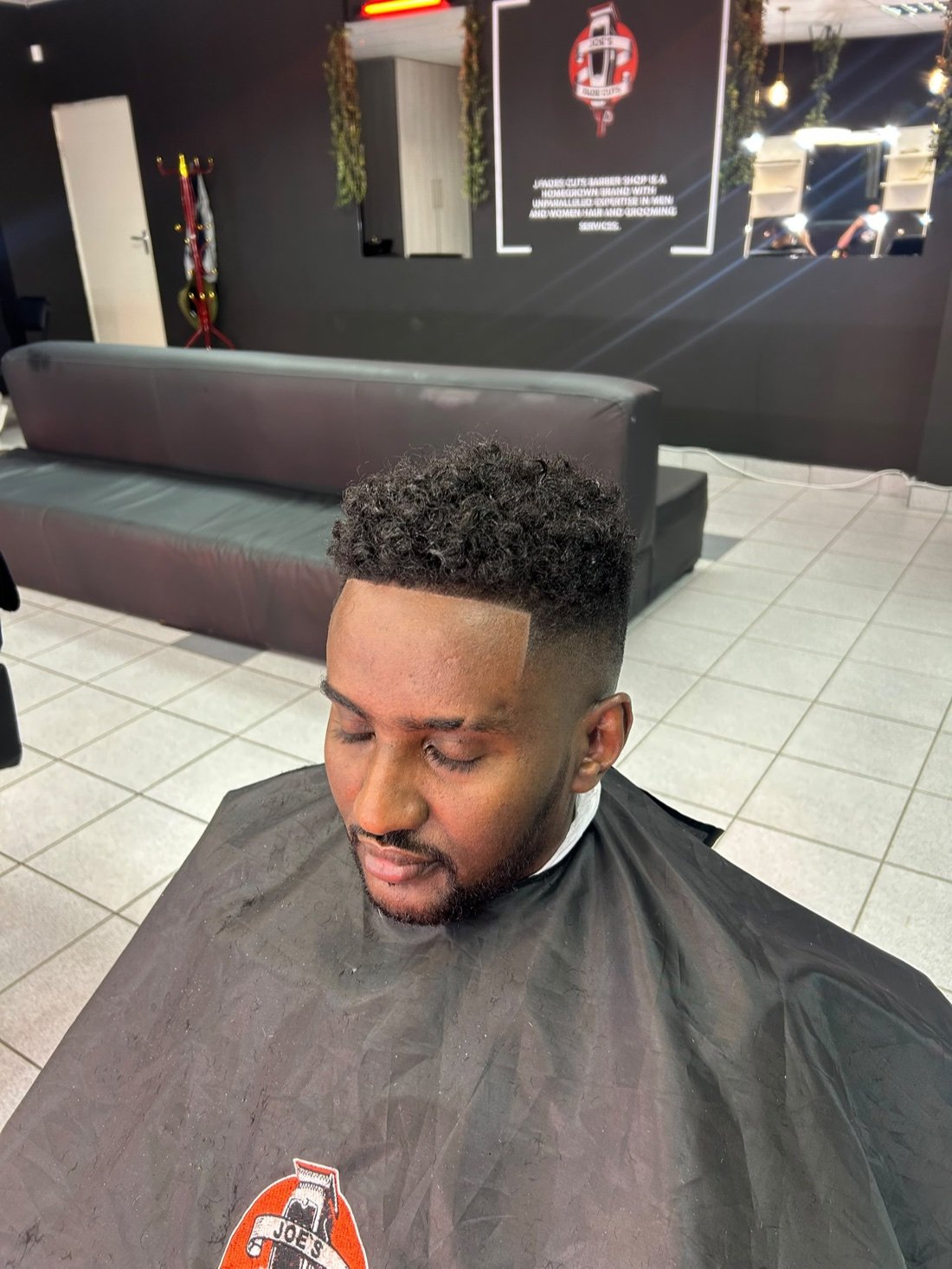 Top-down view of a fresh curly fade